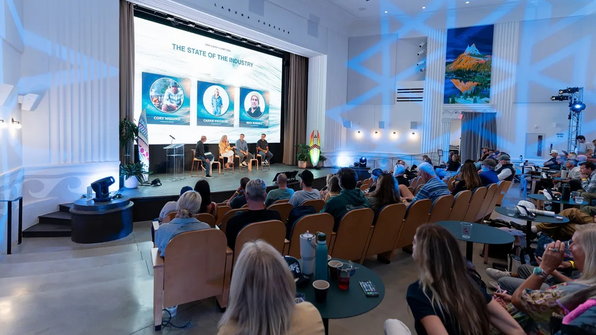 Surf industry leaders and an audience at the 2026 SIMA Super Summit